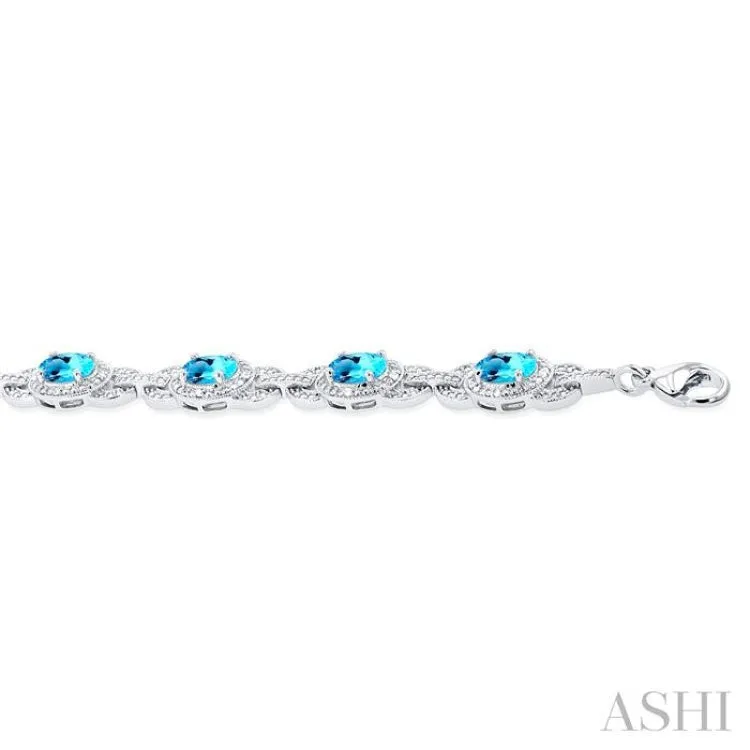 1/10 ctw Oval Shape 7x5 MM Blue Topaz and Round Cut Diamond Semi Precious Bracelet in Sterling Silver