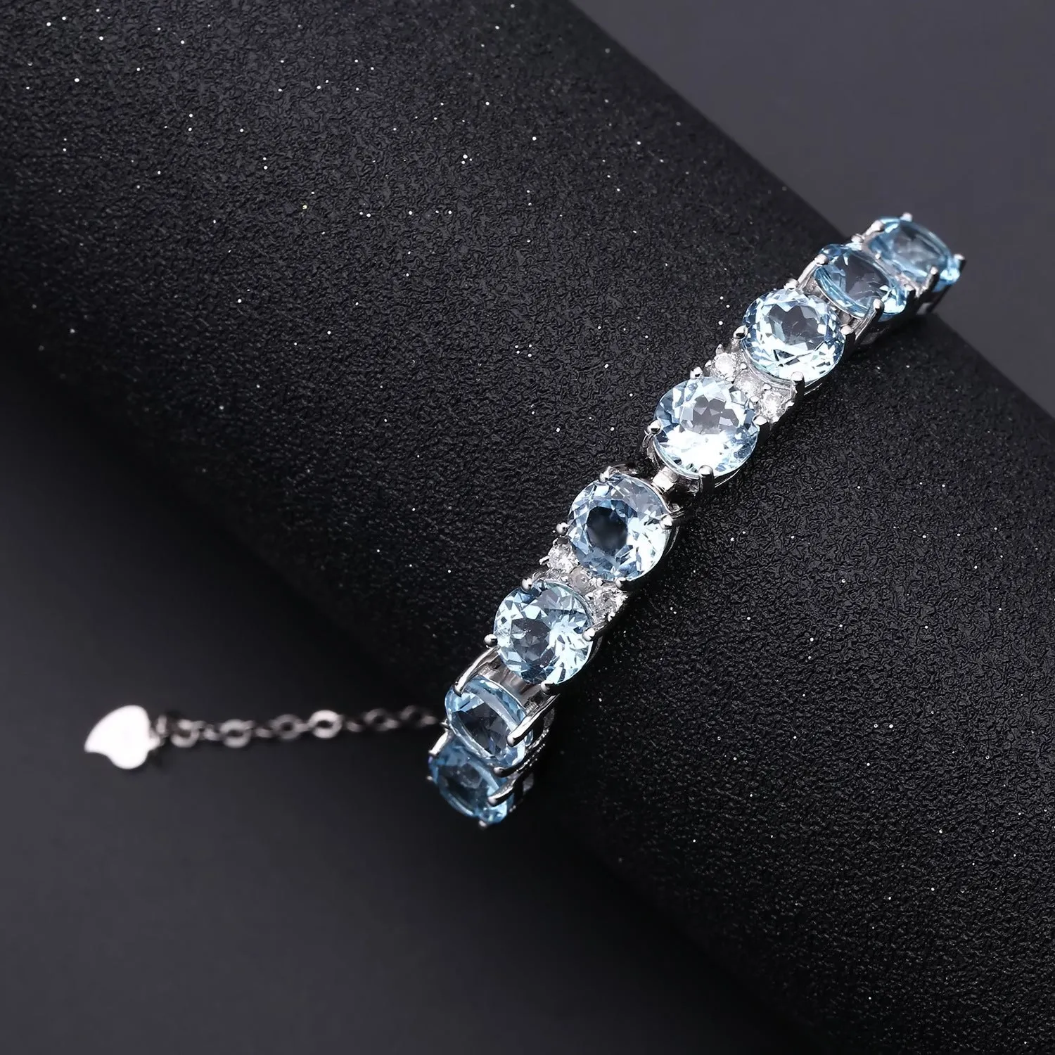 Row of Round Cut Natural Blue Topaz Silver Bracelet